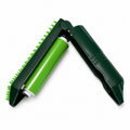Green and black brush tool on a white background